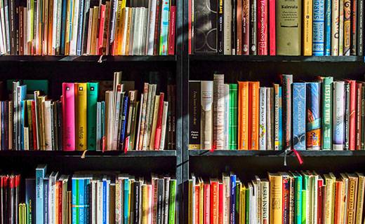 Lots of colourful books on shelves