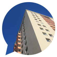 high rise flats against a blue sky