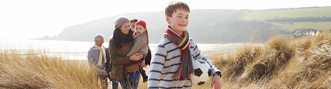 Family hiking along a coastal path
