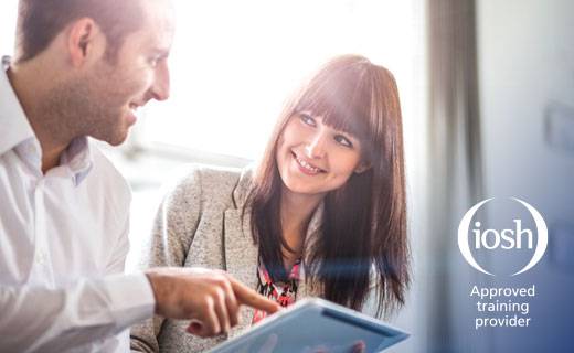 Two business people looking at ipad