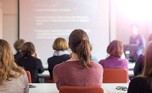 Group of people sitting in a classroom