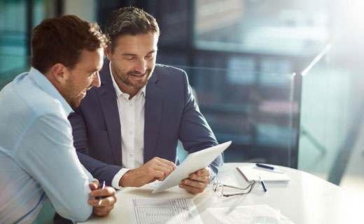 Group of people being taught by business woman