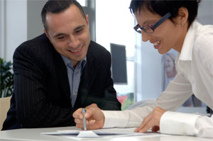 A picture of people in a meeting.