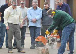 A picture of use of an abrasive wheel tool.