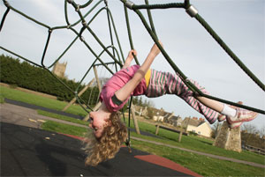 A picture of a child playing on nets