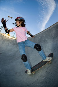 A picture of a child balancing on play equipment.