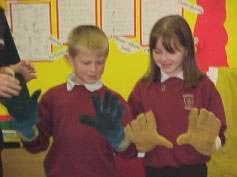 Students try on safety gloves