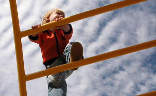 child climbing play equipment