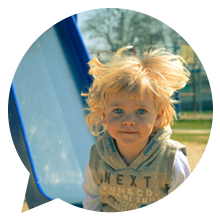 A picture of a child on a slide.