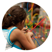 A picture of a child in an indoor play area.